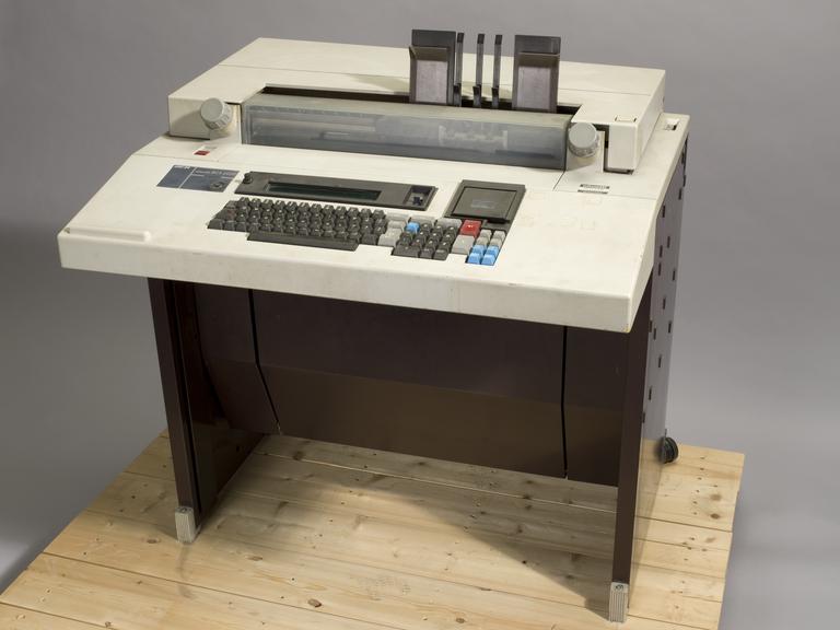 Olivetti BCS2030 Visible Record Computer, c.1970 with integral keyboard and
printer, identification no. 49-YY-29462. On pallet, as stored at Science Museum,...